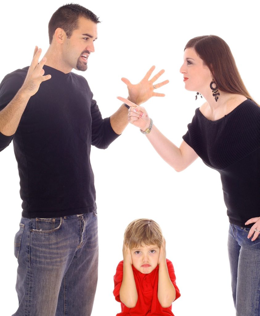 A man and woman arguing over the child.