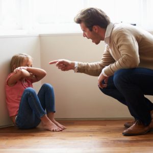 A man scolding a child